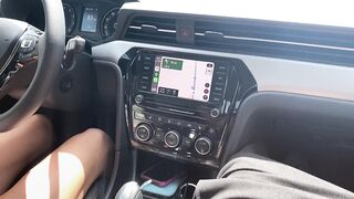A sexy MILF gives a footjob and handjob while driving in POV style